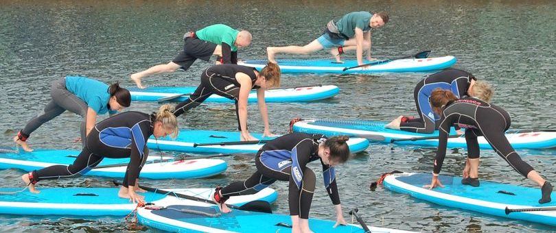 a group of people sitting at a beach