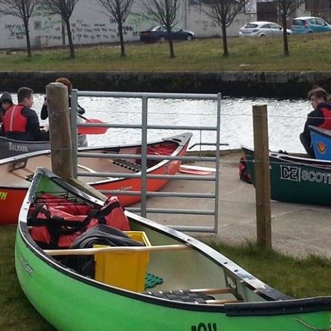 a group of people riding on the back of a boat