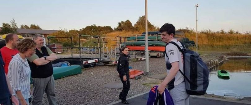 a man standing in a parking lot
