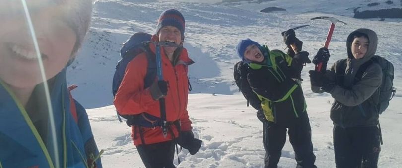 a group of people that are standing in the snow