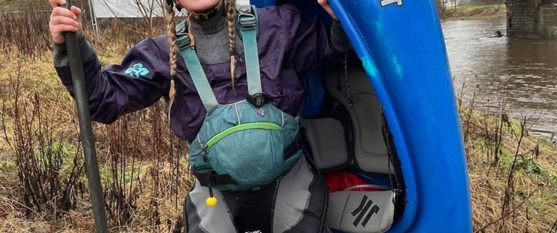 a person holding a bag of luggage