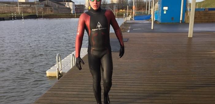 a woman standing next to a body of water