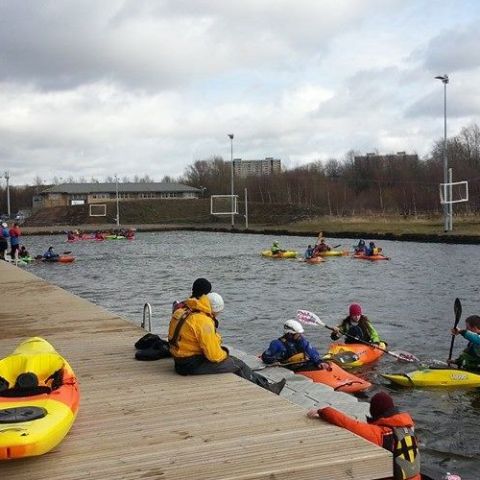 a group of people riding on the back of a boat