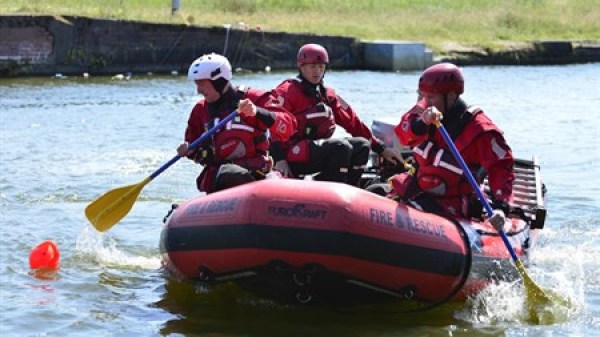 Fireandrescue-1920 a group of people on a raft in a body of water