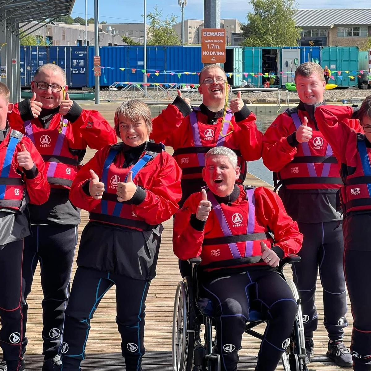a group of people posing for the camera