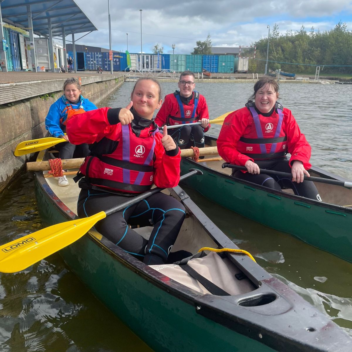 a group of people riding on the back of a boat