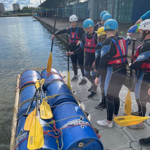 a group of people on a boat in the water
