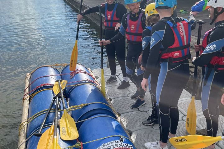 a group of people on a boat in the water