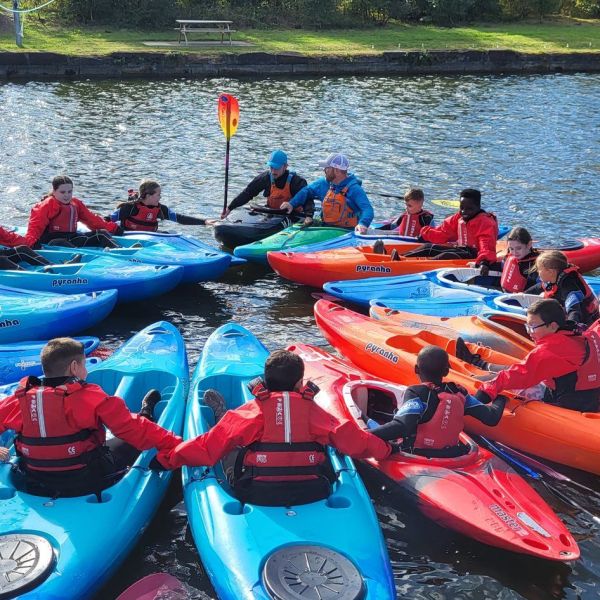 a group of people on a raft in a body of water