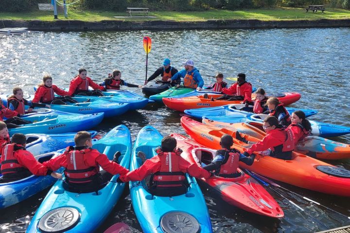 a group of people on a raft in a body of water