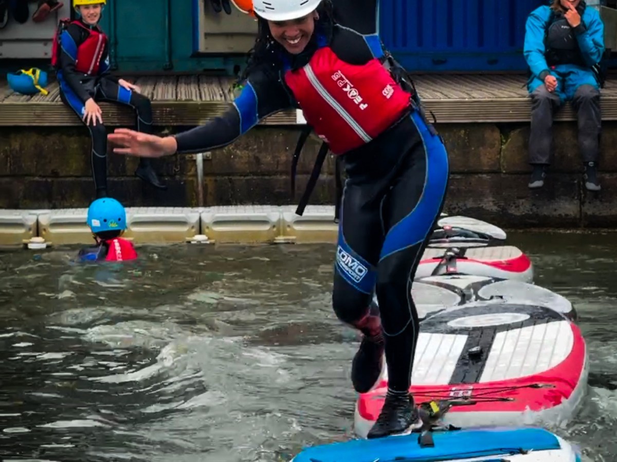 a group of people riding on the back of a boat
