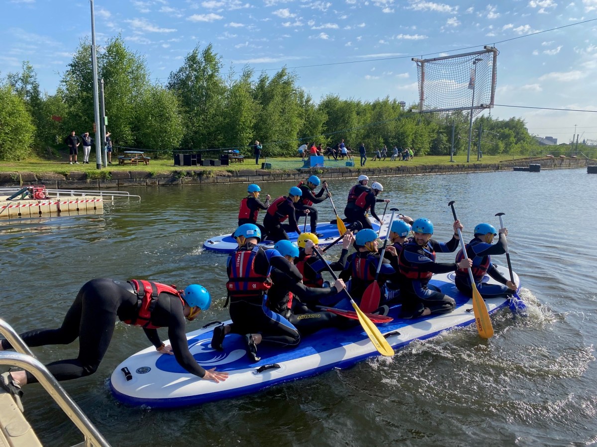 a group of people on a raft in a body of water