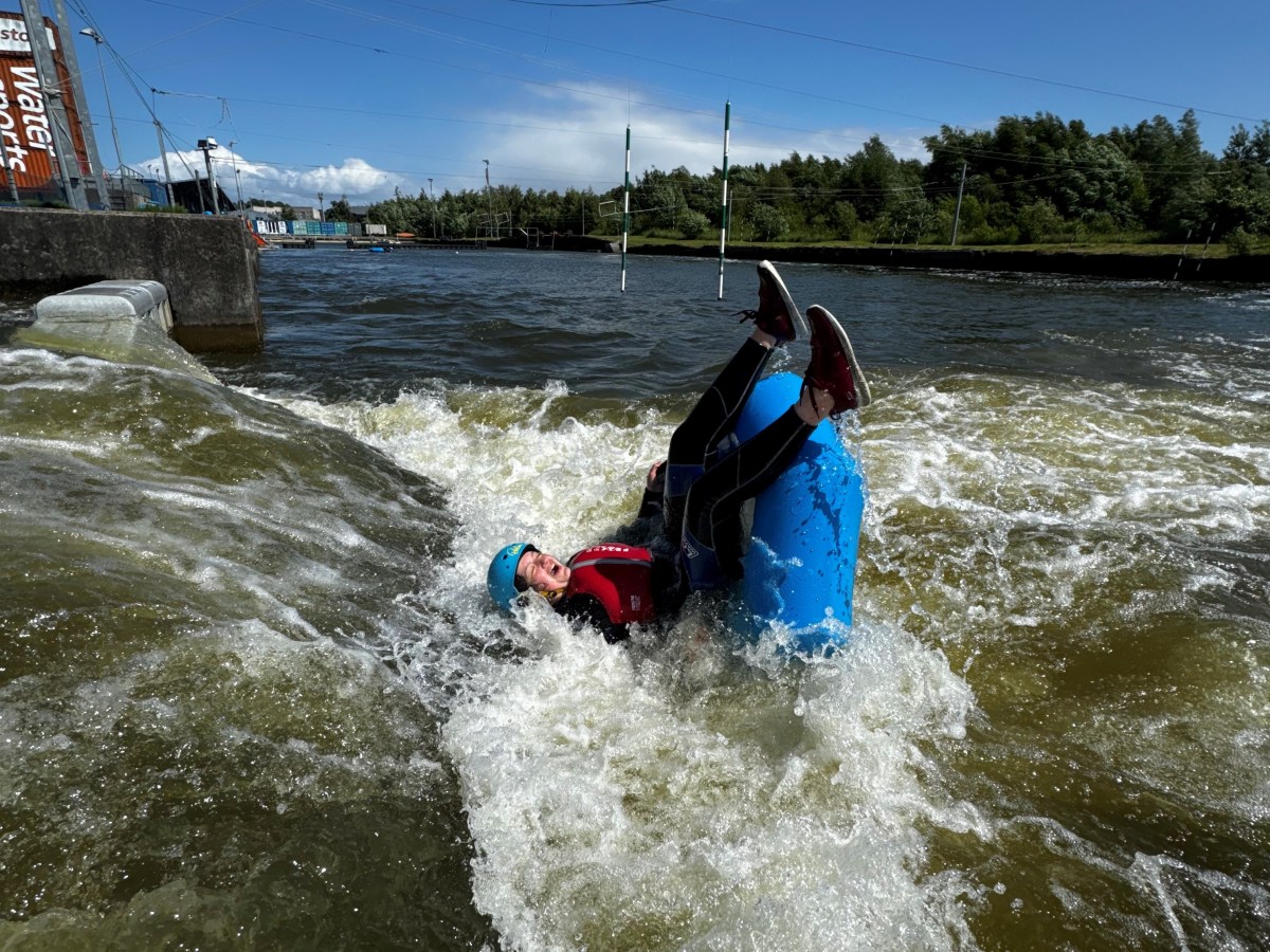 a person riding a surf board on a body of water