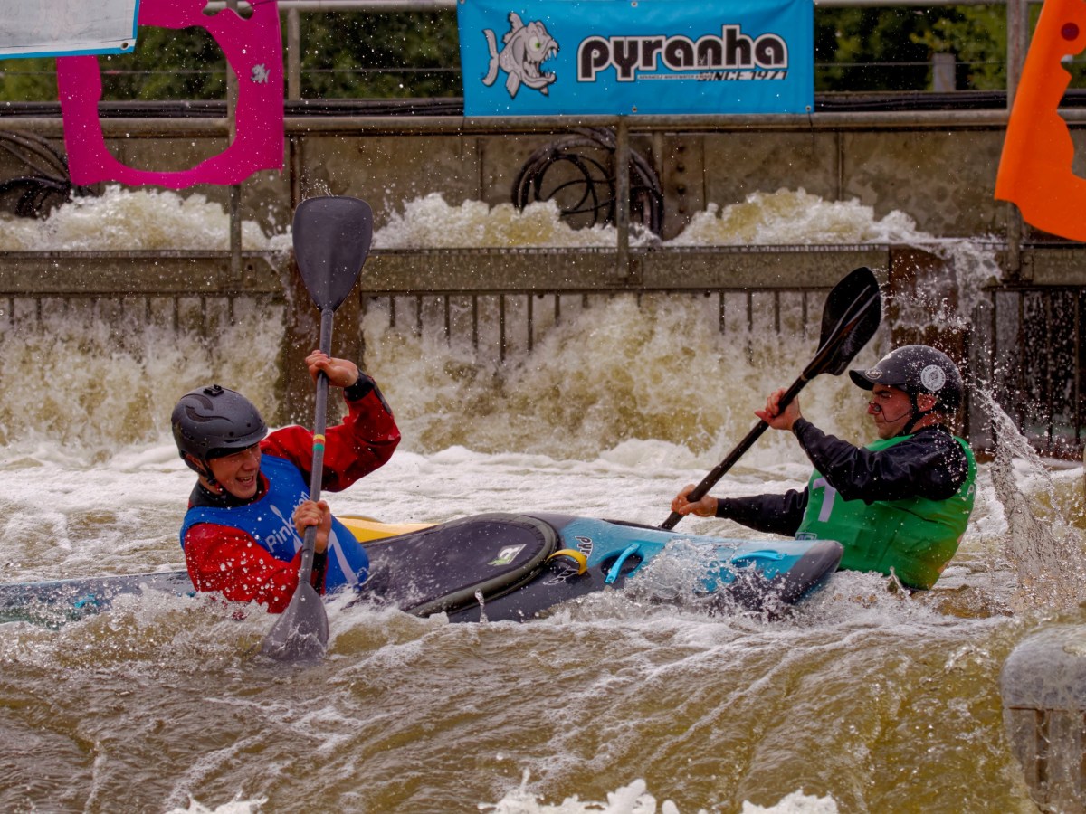 a group of people riding skis on a raft in a pool