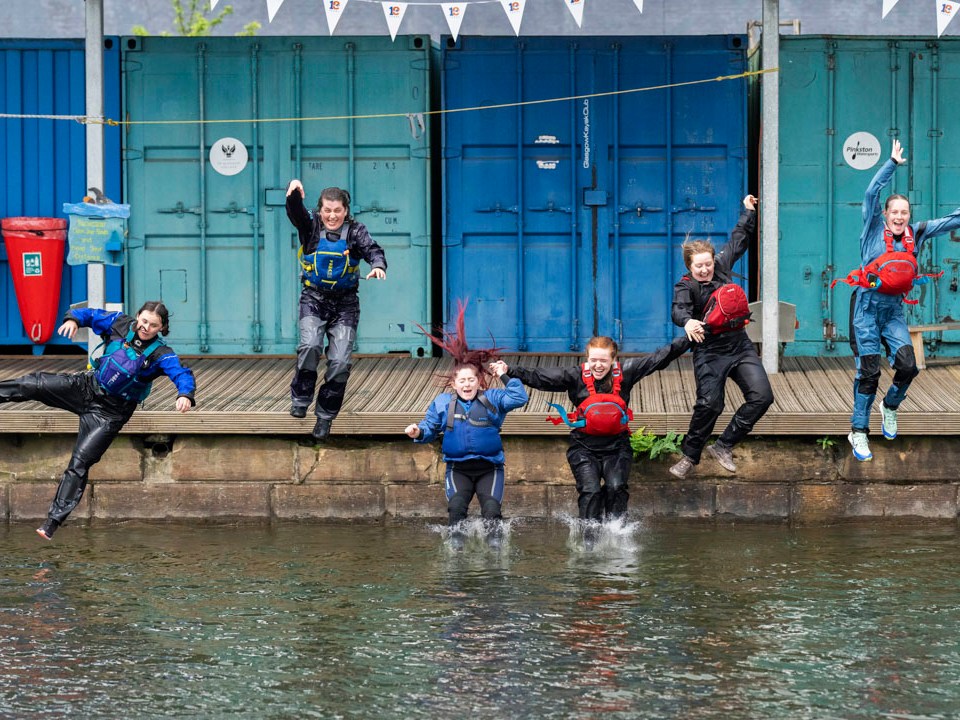 a group of people standing in front of a building